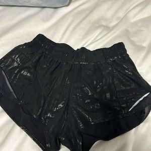 Lululemon black hotty hot shorts with writing. Low rise, size 6, 2.5” inseam